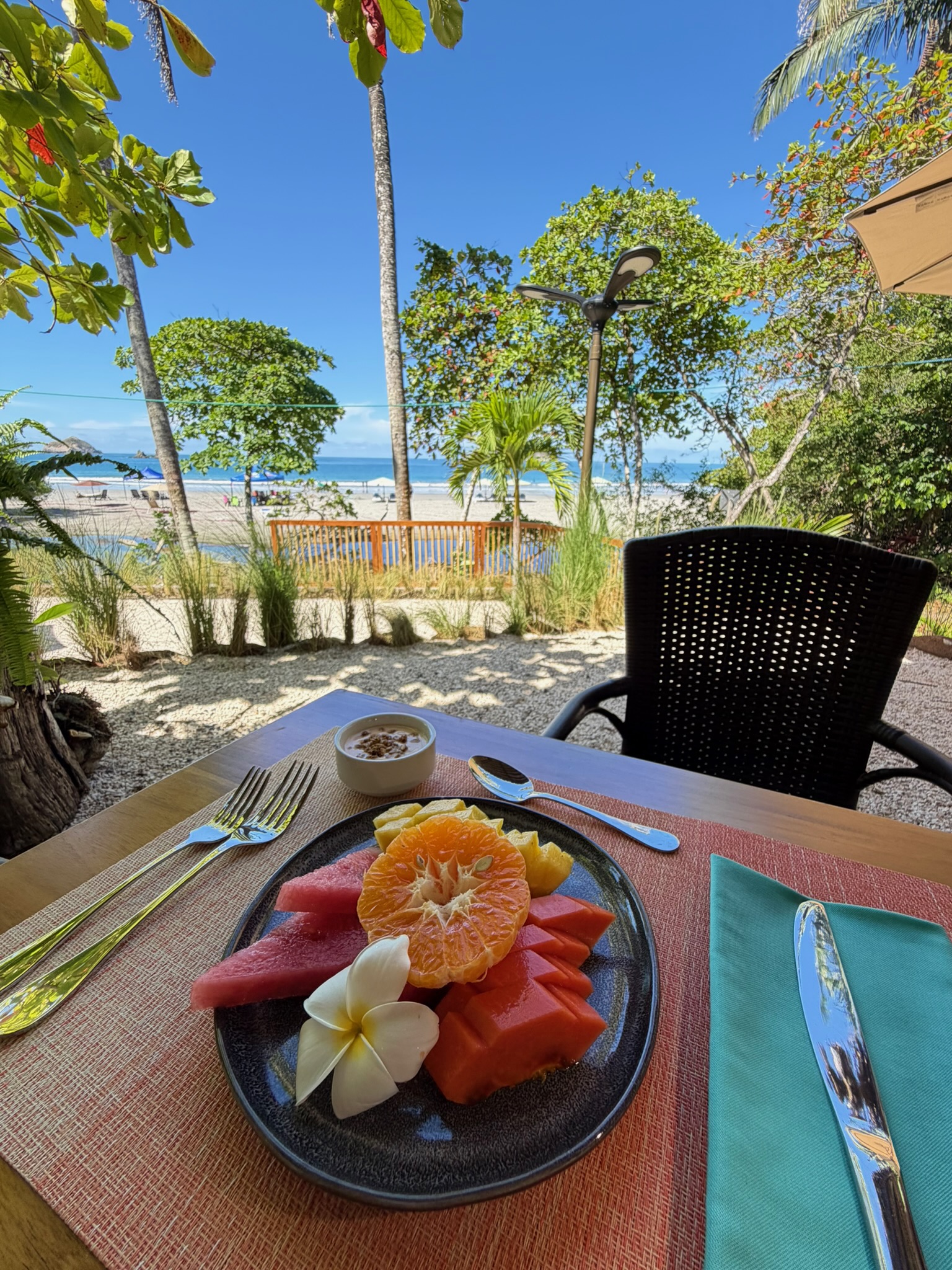 Beachfront dining plate at Miamar with Pacific Ocean view