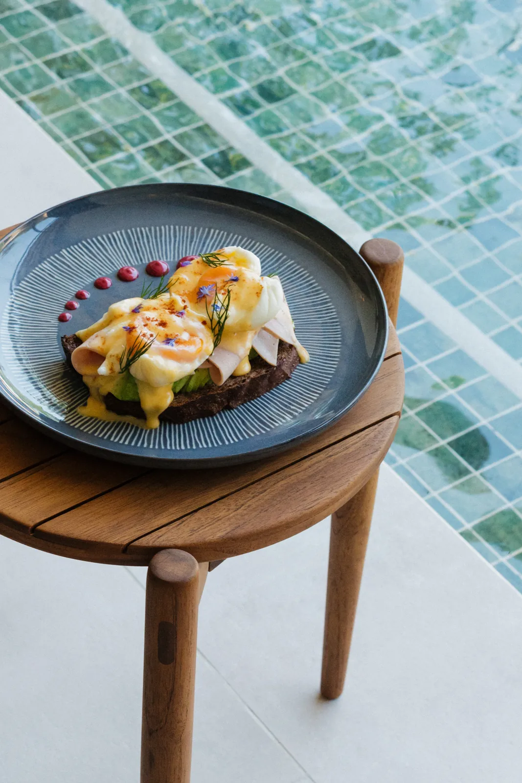 Breakfast at Yemaya: poached egg on toast, served by the pool